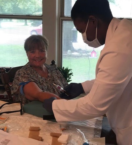 Friendly phlebotomist ready to provide mobile blood draw service