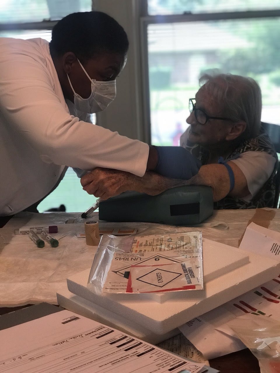 Certified phlebotomist providing homebound patient care